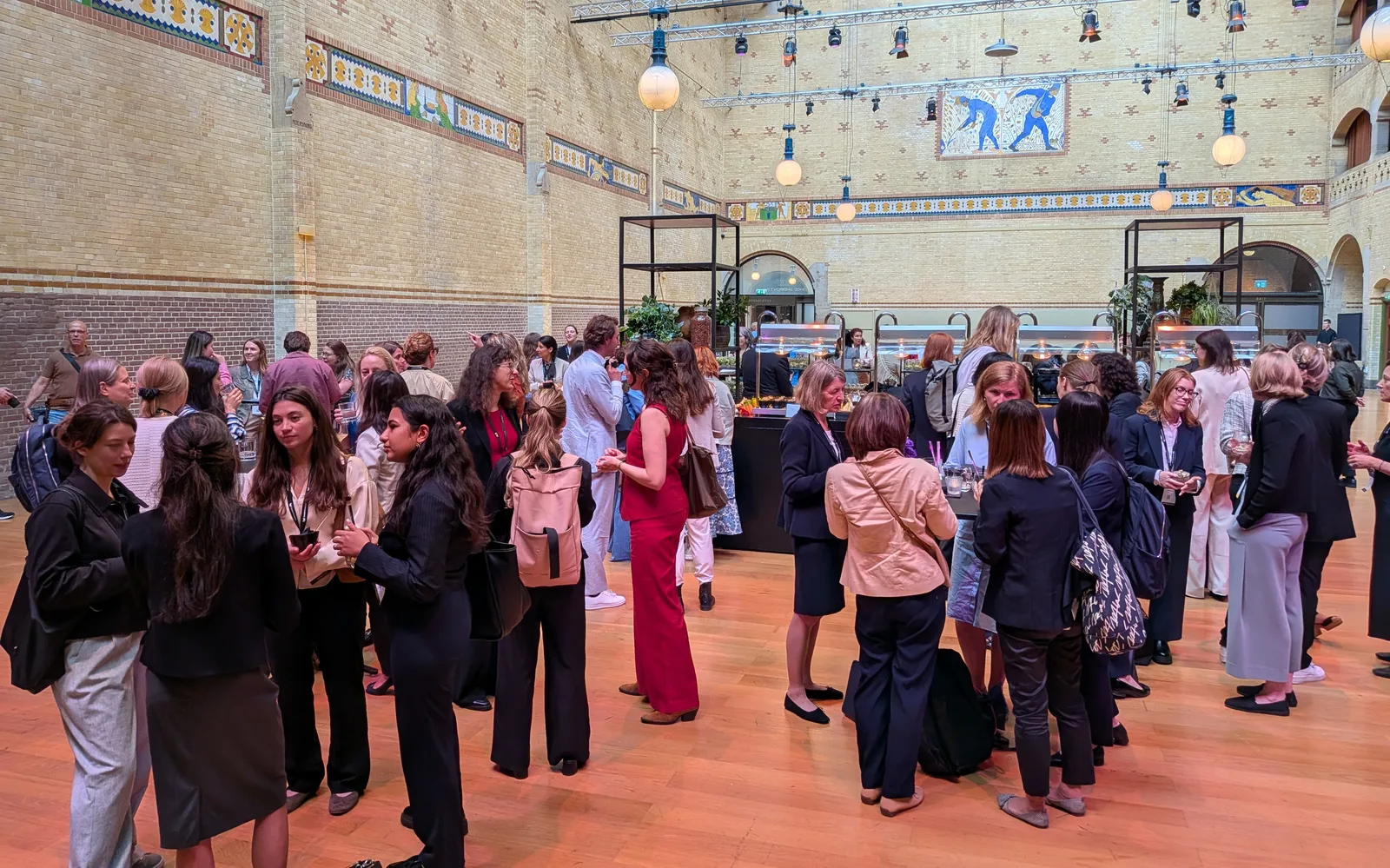 Members of the Women in SAF community talking at an industry event