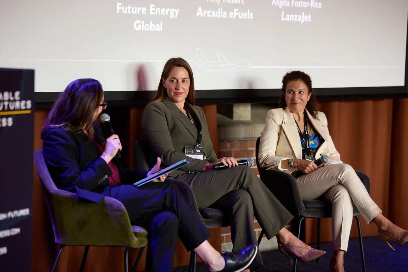 A panel discussion at a Women in SAF event, with Future Energy Global named on the screen behind